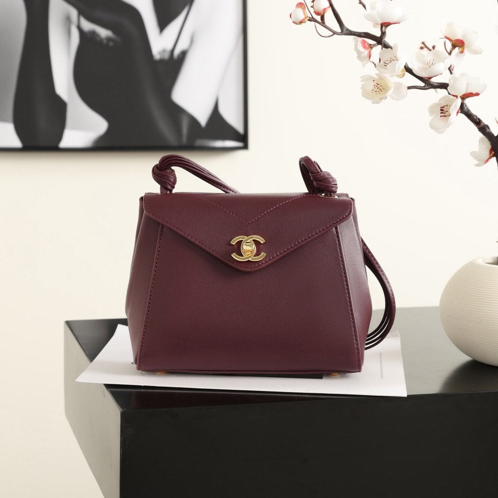 Elegant Burgundy Structured Shoulder Bag with Gold-Tone Clasp