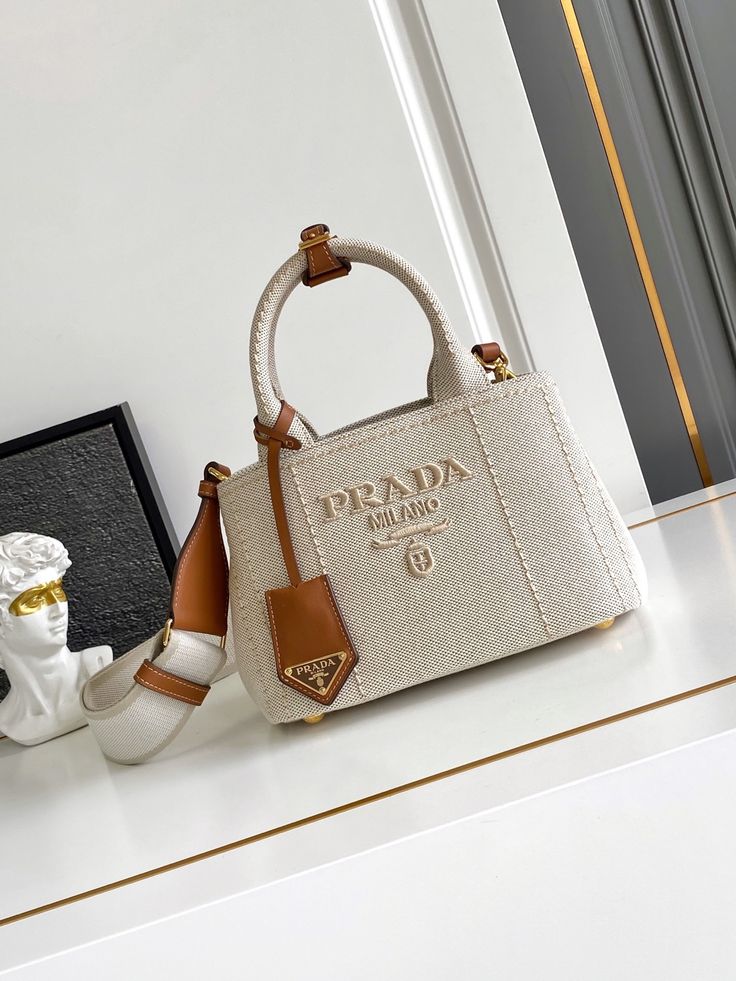 Elegant Cream Canvas Handbag with Brown Leather-Style Accents