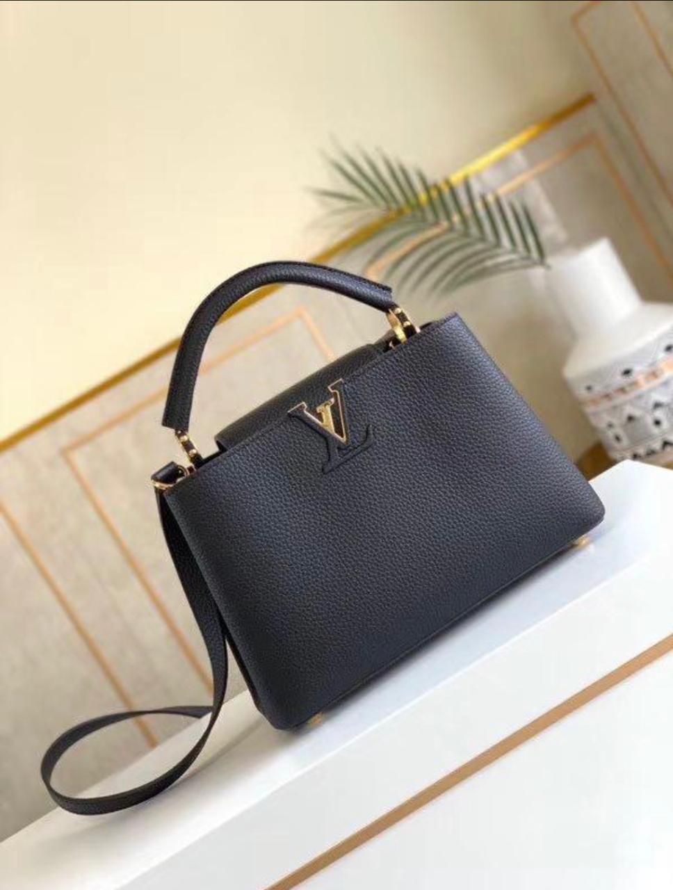 Elegant Black Structured Top-Handle Handbag with Gold V-Clasp