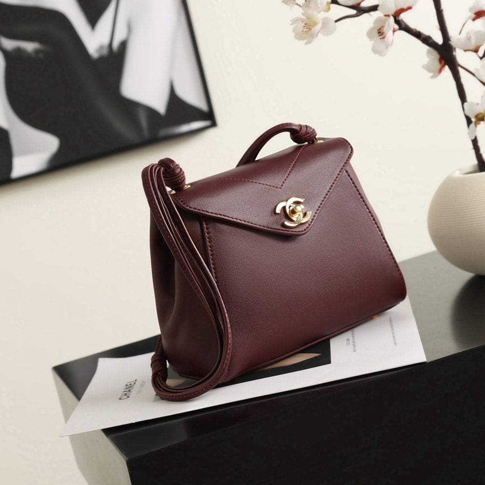 Elegant Burgundy Structured Shoulder Bag with Gold-Tone Clasp