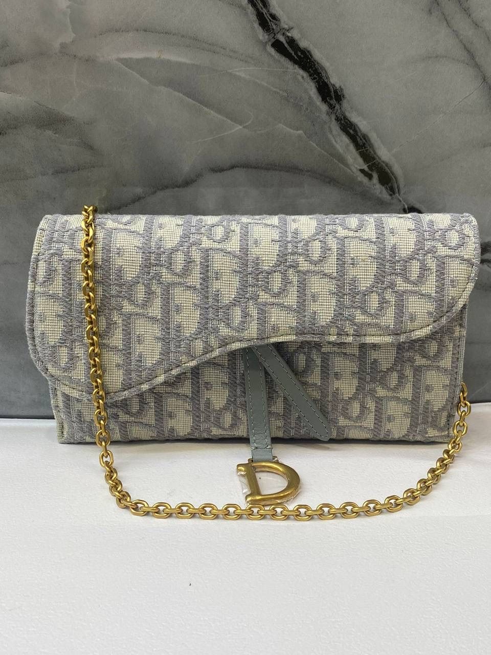 Elegant Grey Monogram Shoulder Bag with Gold-Tone D Clasp