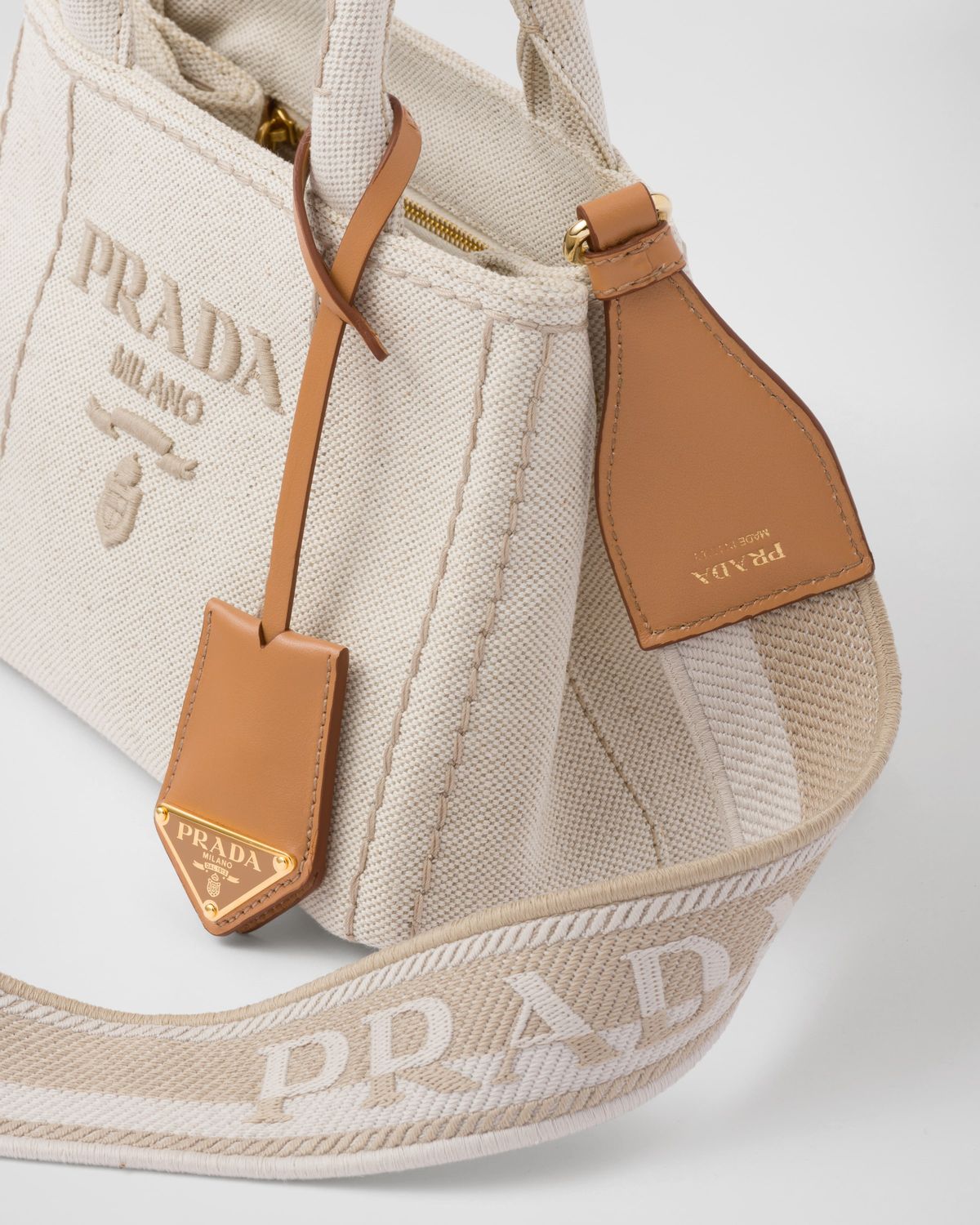 Elegant Cream Canvas Handbag with Brown Leather-Style Accents
