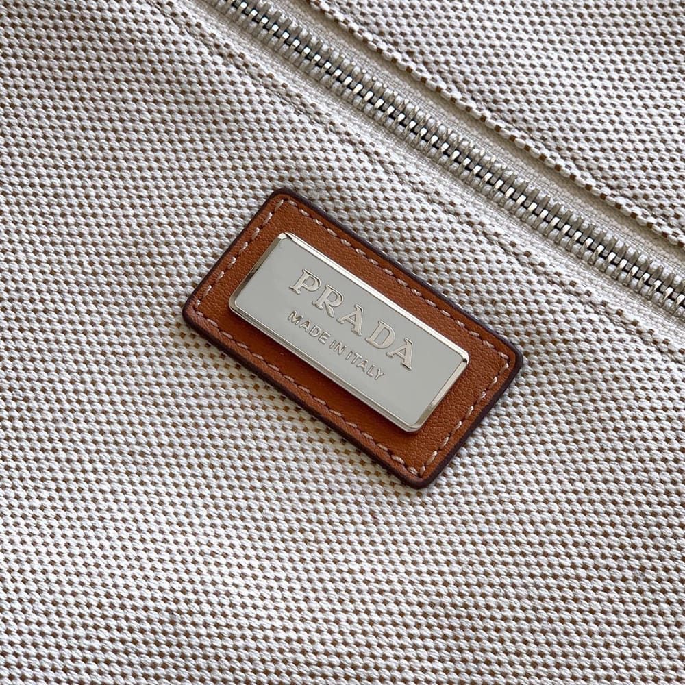 Elegant Cream Canvas Handbag with Brown Leather-Style Accents