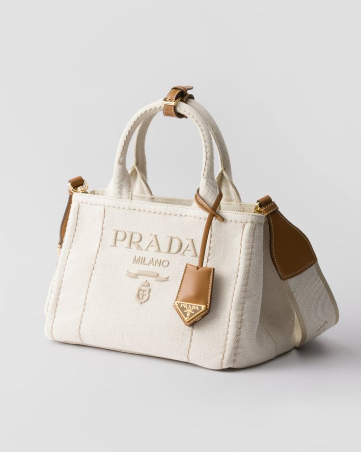 Elegant Cream Canvas Handbag with Brown Leather-Style Accents