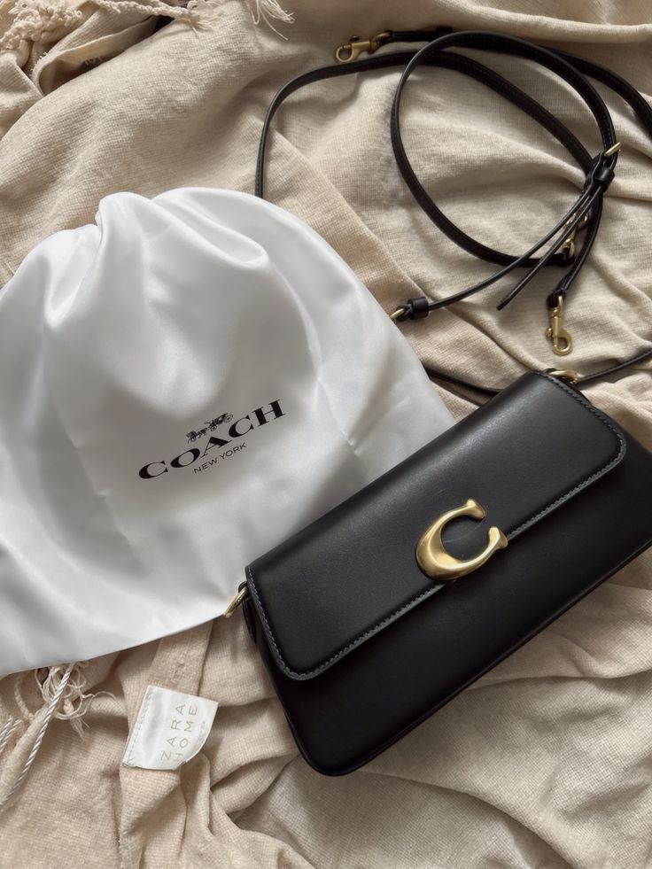 Elegant Black Structured Shoulder Bag with Gold-Tone C Clasp