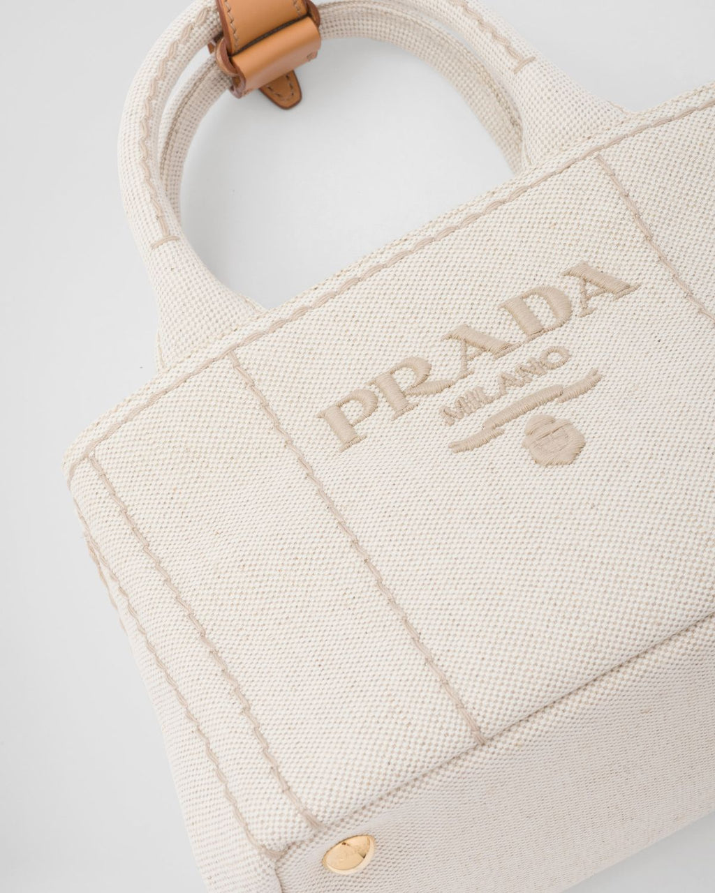 Elegant Cream Canvas Handbag with Brown Leather-Style Accents